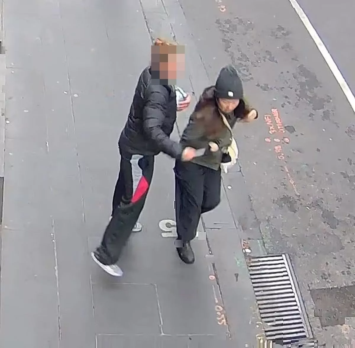 Horror moment woman is stabbed in the chest by stranger while she walks to work (video)